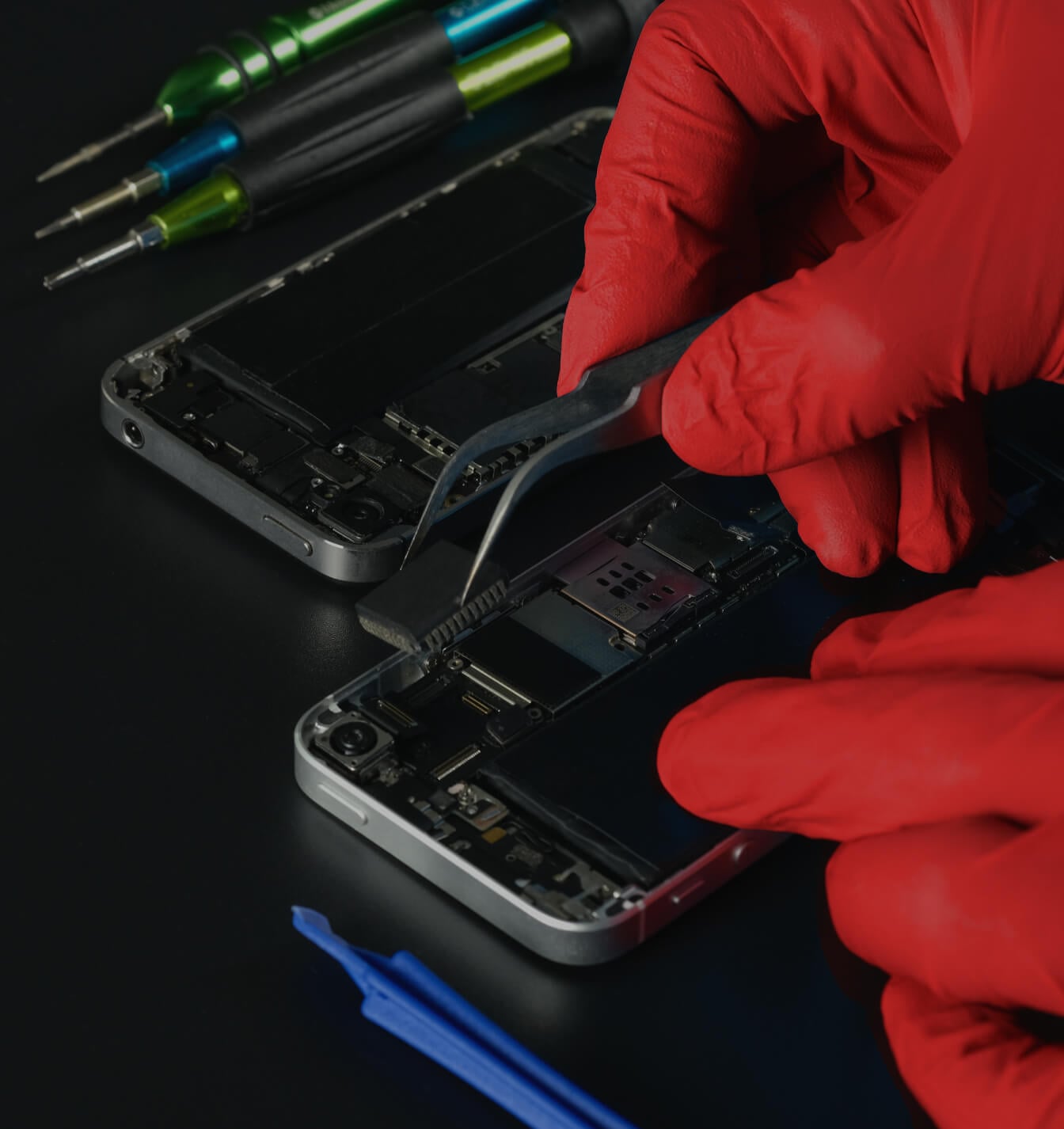 repair technician fixing broken phone in natchez